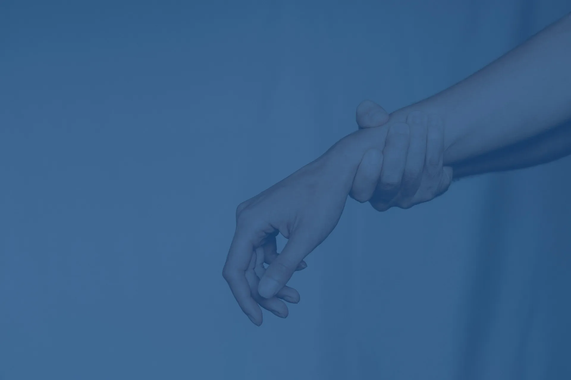 person holding their wrist